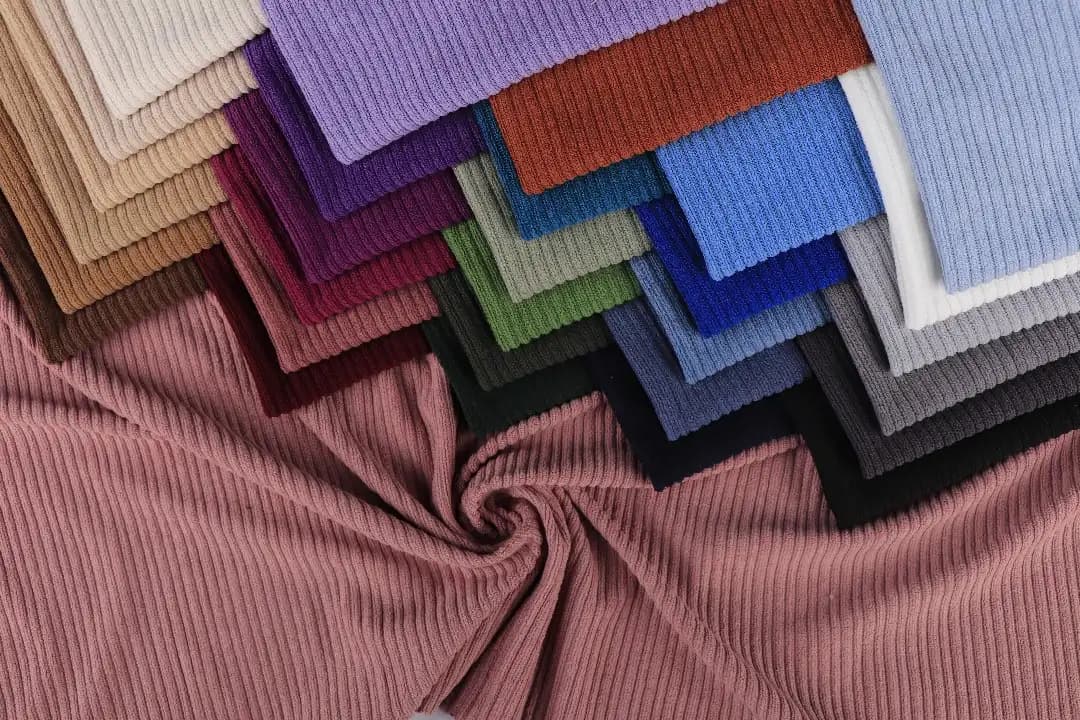 Fashion designer selecting fabric at K&K Textile showroom